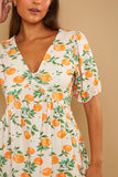 Printed Twist Front Pep Hem Jersey Top