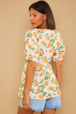 Printed Twist Front Pep Hem Jersey Top